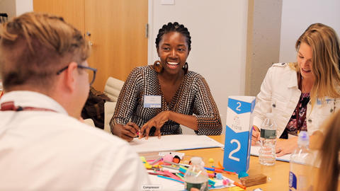Three people collaborating on a project